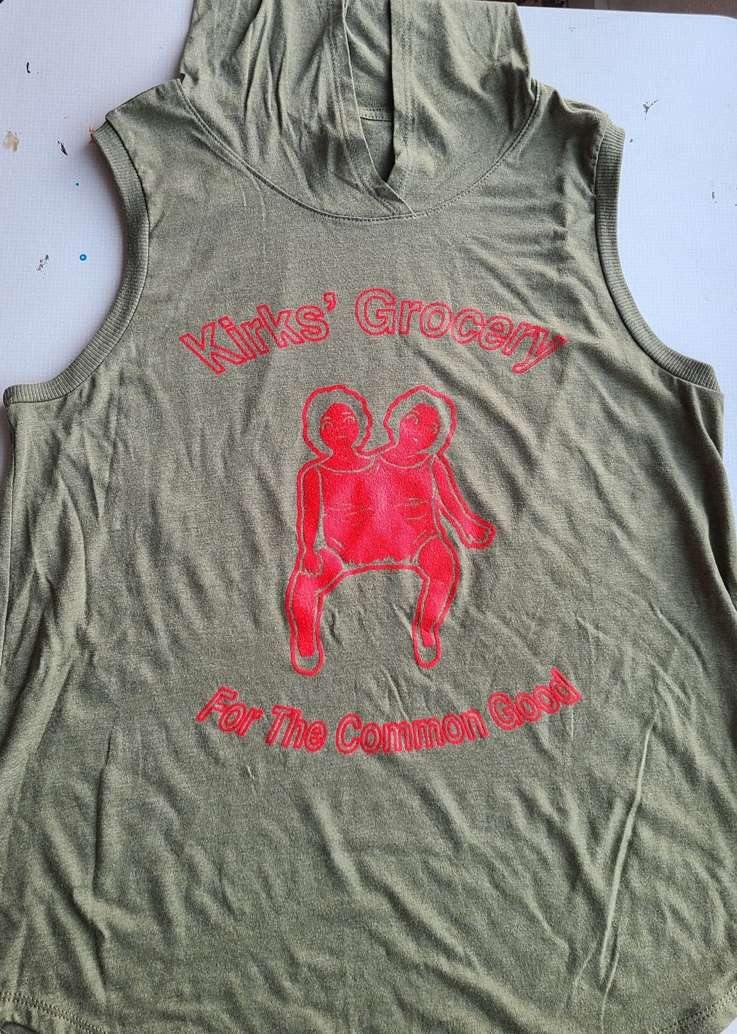 Kirks' Grocery Sleeveless Hoodie |Two Headed Doll (Red on Green)